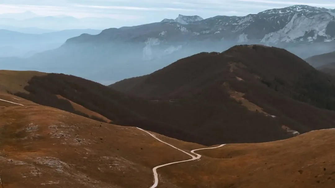 A road winding through the ridges of Bjelašnica